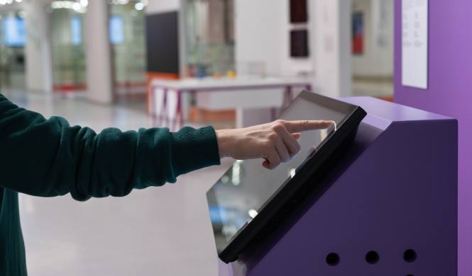 Attendees using onsite registration kiosks at a conference