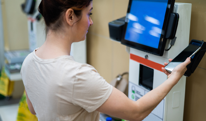 Self-service kiosk managing rapid walk-in payment and badge printing